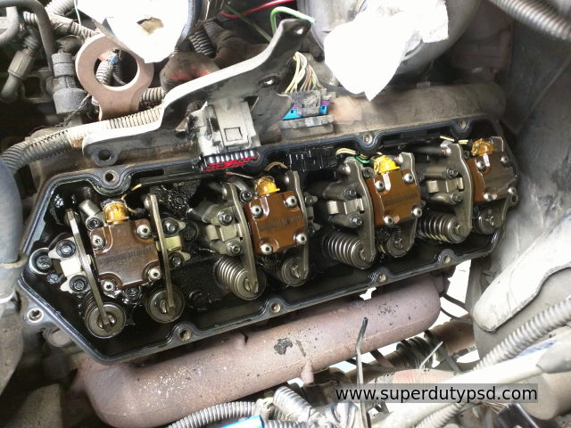 cylinder head with valve cover off and electrical connection