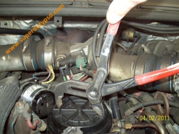 Using Channellock pliers to remove fuel filter cap.