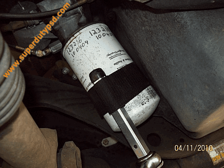 loosening oil filter with strap wrench